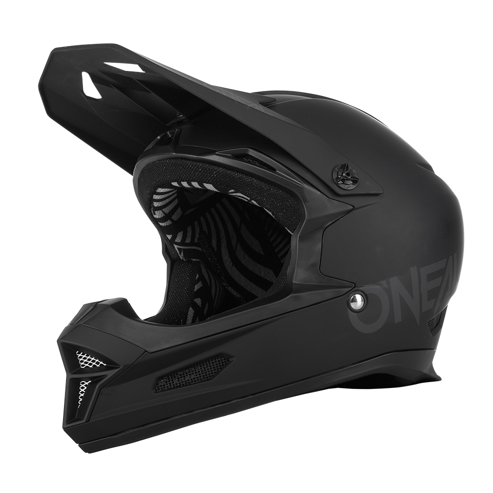 Der O'NEAL FURY Helm SOLID ist ein eleganter, mattschwarzer Integralhelm für Motocross mit schwarz-weiß gestreifter Innenseite. Dieses Modell verfügt über ein großes Visier und markante Belüftungsöffnungen. Der Markenname „O’NEAL“ ist dezent auf der Seite aufgedruckt. Das Design legt den Schwerpunkt auf Sicherheit und aerodynamische Funktionalität.